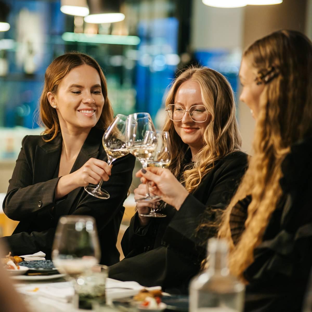 Women clinking glasses