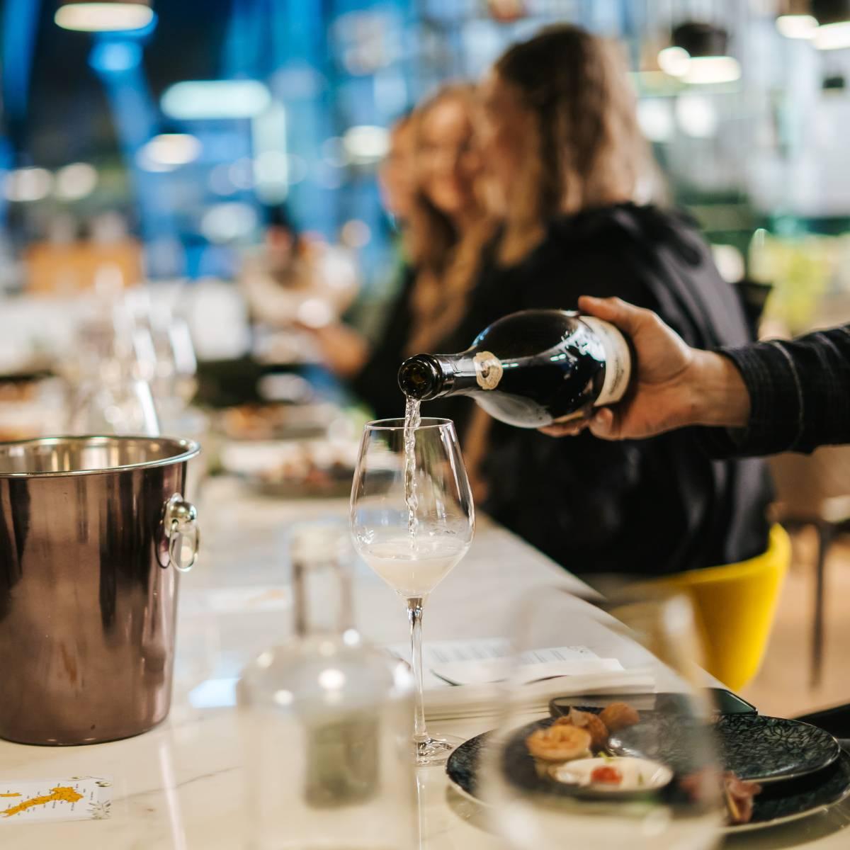 Pouring a glass of sparkling wine