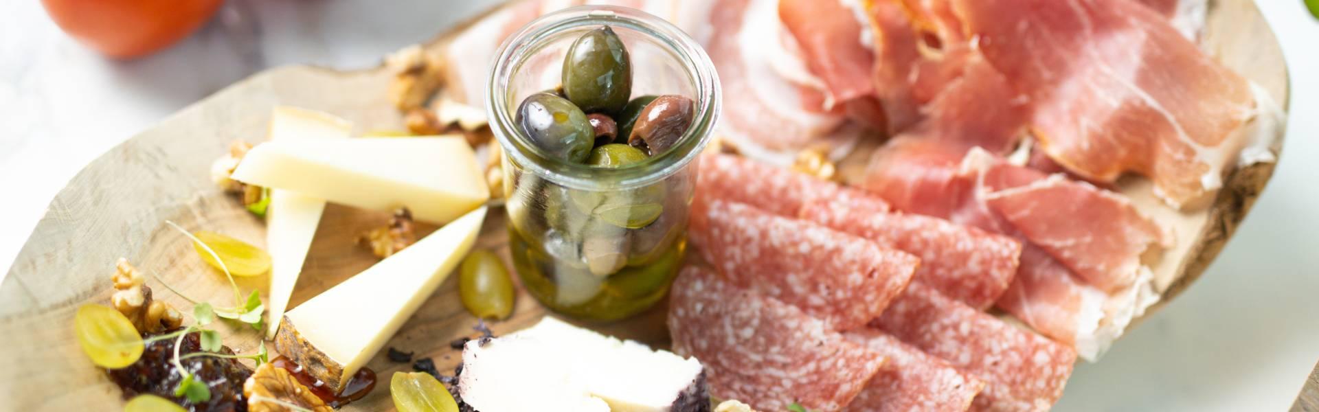 Selection of cured meat and cheese