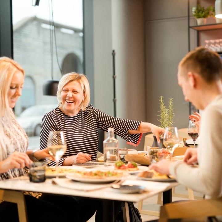 Woman laughing at the table