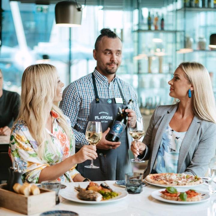 Waiter presenting wine selection