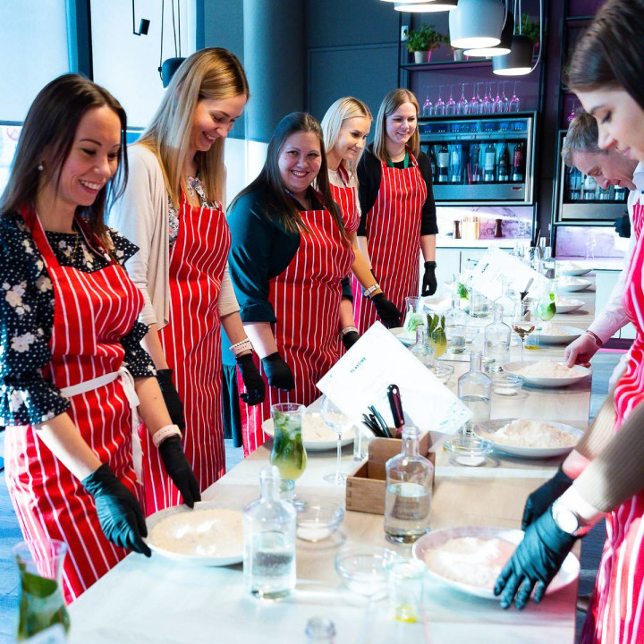 People standing at table in cooking school